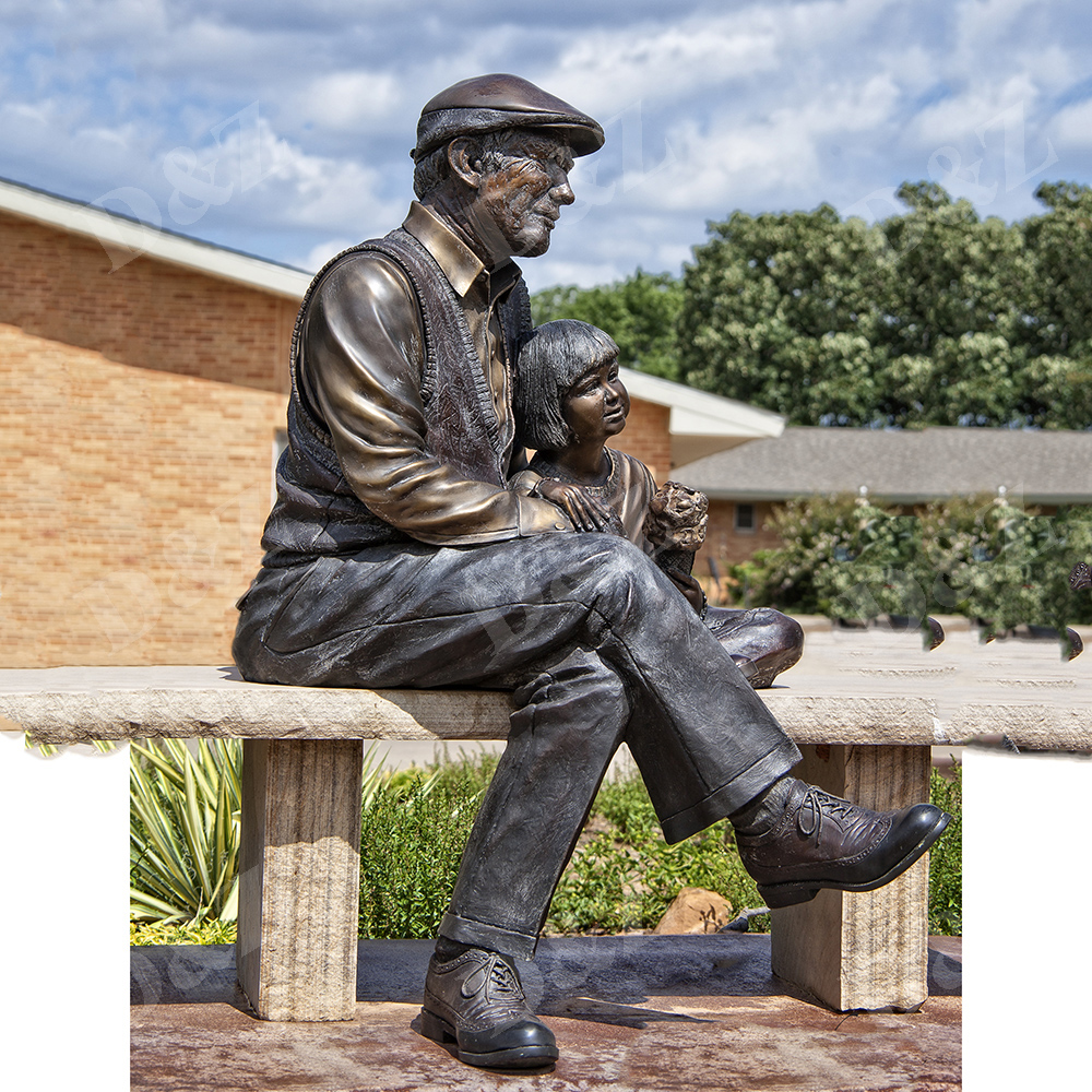 grandfather sitting on bench with cut baby bronze sculptures